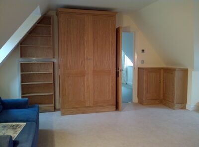 Oak wardrobe, cupboard and shelves.